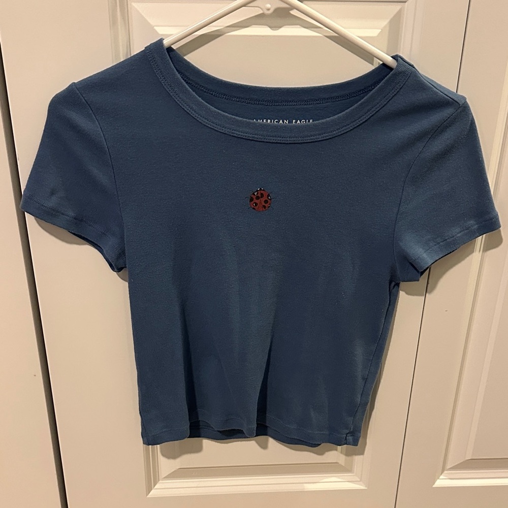 Blue American Eagle Crop Top with Ladybug Patch